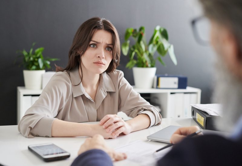 young-confused-woman-looking-at-hr-manager-asking-her-personal-question.jpg